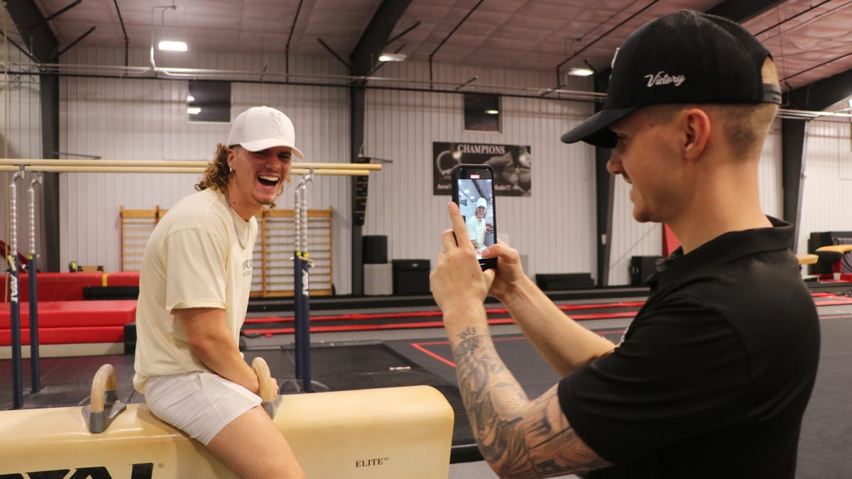 See the Phillips siblings film gymnastics content for social media at their gym in Marion